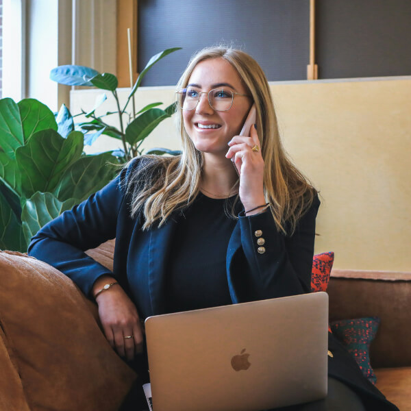 Lady sitting on sofa on the phone