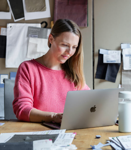 Lady working at messy desk